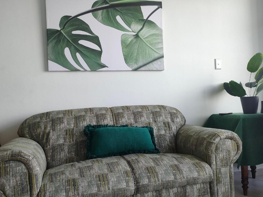 Lounge sofa with monstera wall art