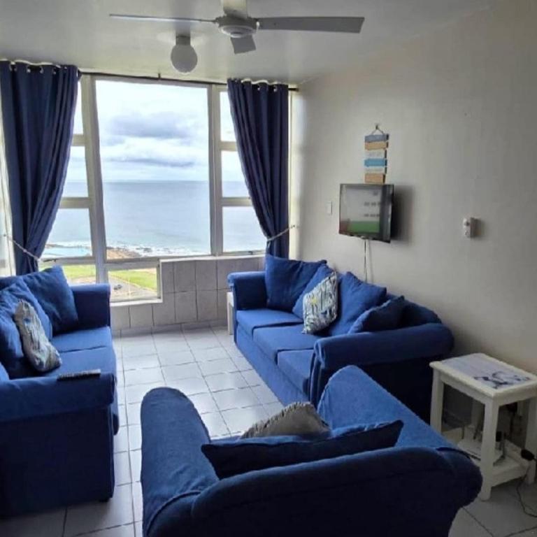 Lounge with navy couches and ocean view